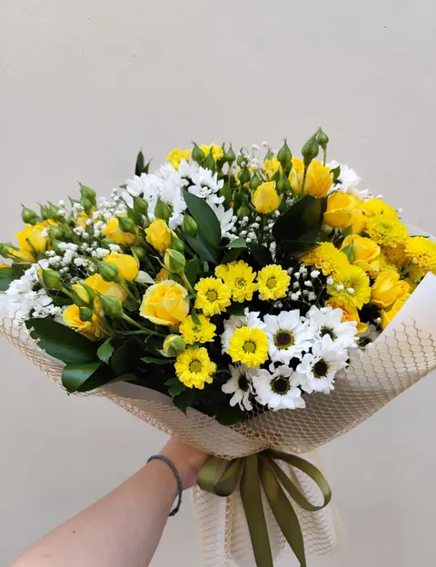 Bright Celebration Bouquet with spray roses, chrysanthemums, gypsophila, and greenery.
