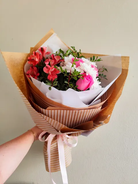 Classic Rose & Alstroemeria Bouquet with roses, alstroemerias, chrysanthemums and pistachio greenery.