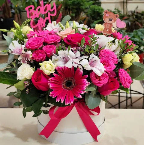 Pink flower box with mini roses, gerbera, lisianthus, alstroemeria, and greenery, sweet floral arrangement for baby girl.