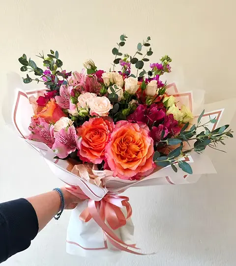 Sweet Bloom Bouquet with roses, matthiola, alstroemeria, and greenery.