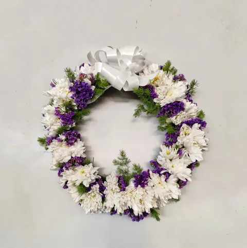 Funeral wreath with chrysanthemums and statice flowers, elegant sympathy arrangement for memorial and remembrance