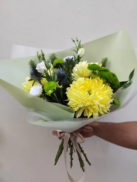 Flower bouquet with Anastasia chrysanthemums, lisianthus, green chrysanthemums, and eryngium – fresh mixed floral arrangement